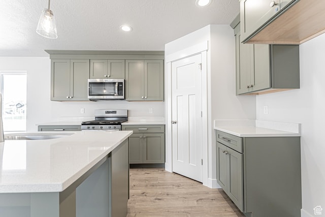 1091 N 3620 W Unit 272, Lehi, UT 84043 - kitchen featuring stainless steel appliances, gray cabinetry, light wood-type flooring, light countertops, and recessed lighting