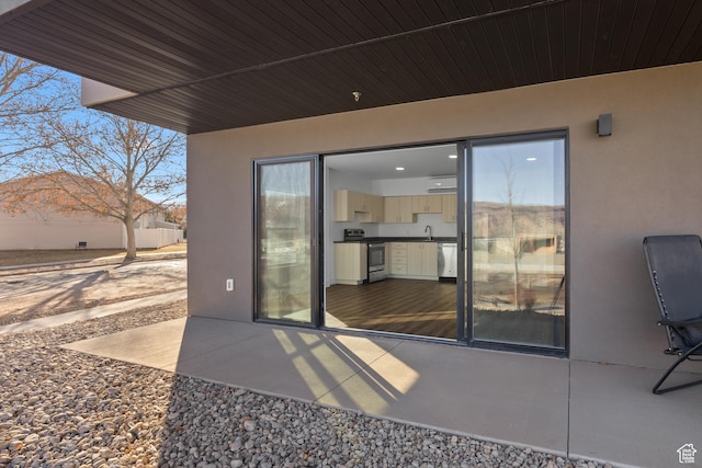 443 Kane Creek Blvd Unit A106, Moab, UT 84532 - view of patio / terrace with an AC wall unit and sink