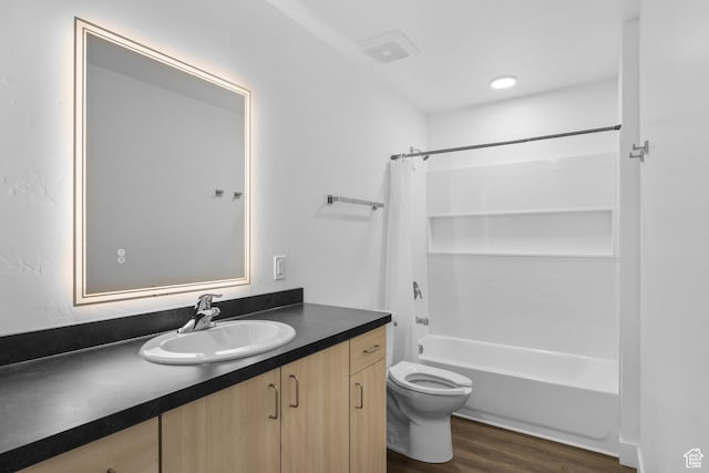 443 Kane Creek Blvd Unit A106, Moab, UT 84532 - full bathroom featuring wood-type flooring, toilet, vanity, and shower / bath combo