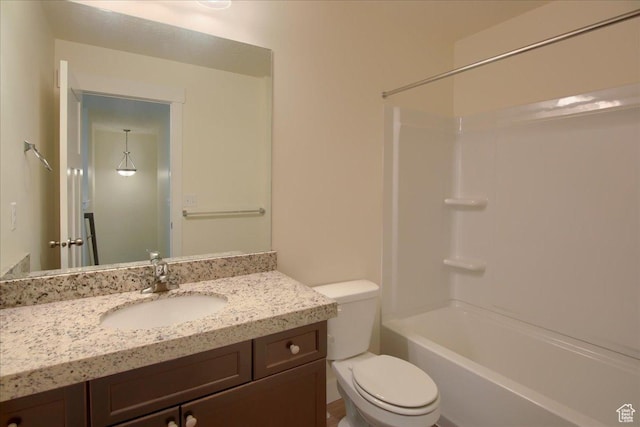 full bathroom with vanity, toilet, and washtub / shower combination