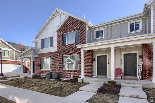 view of front of house with central AC unit and covered porch