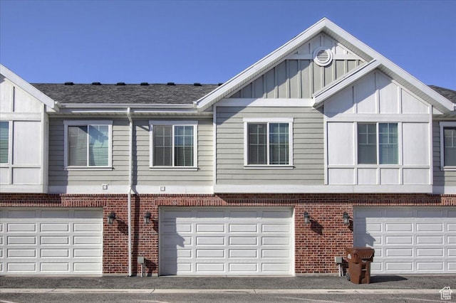 multi unit property featuring a garage