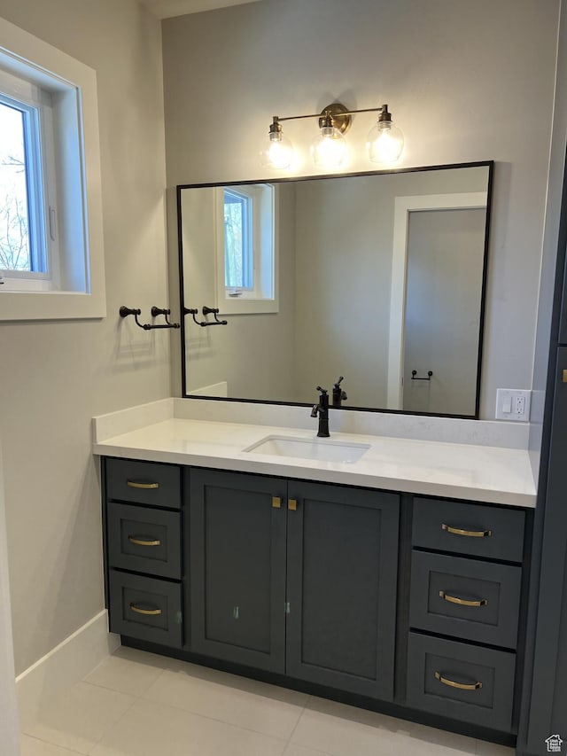 bathroom with vanity, plenty of natural light, and tile patterned floors
