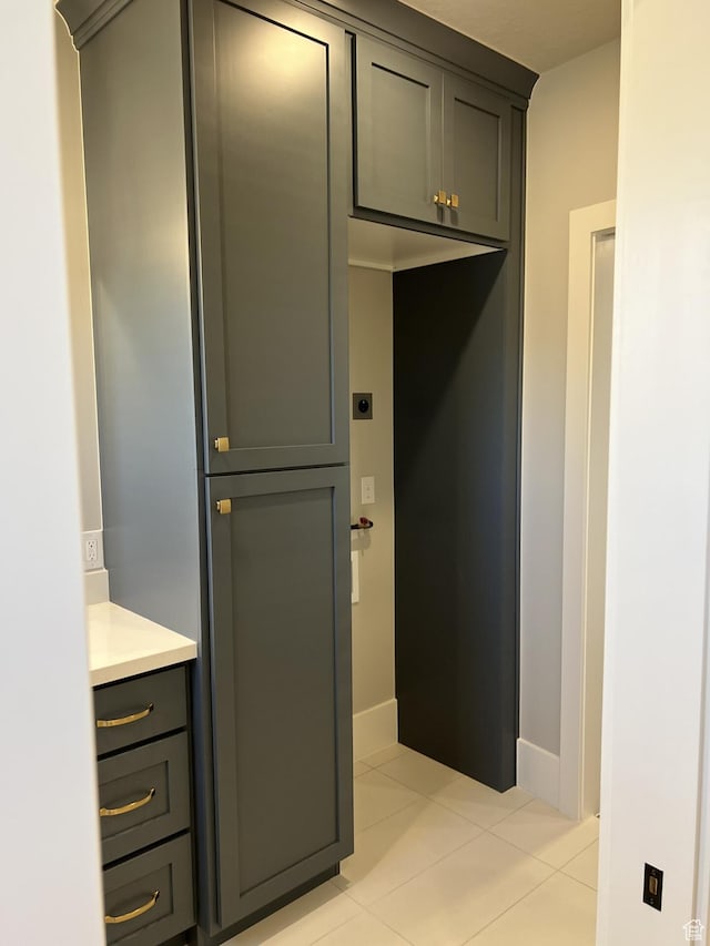 interior space featuring vanity and tile patterned floors