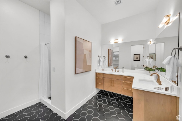 bathroom featuring lofted ceiling, vanity, and a shower