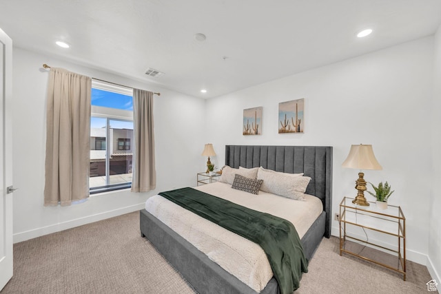 bedroom with light colored carpet