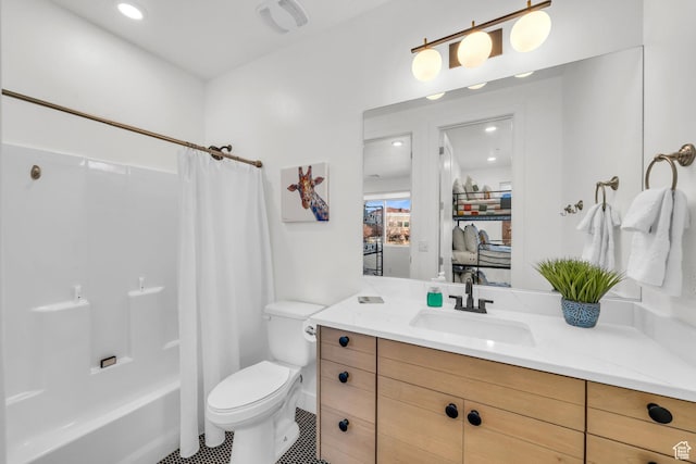 full bathroom with shower / bath combination with curtain, vanity, and toilet