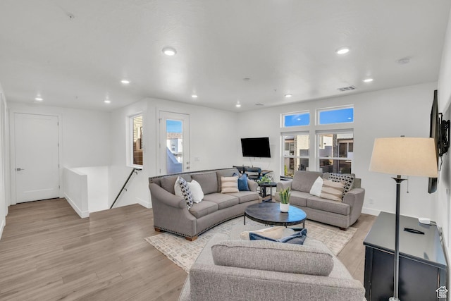 living room with light hardwood / wood-style flooring