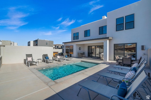 view of pool featuring a patio