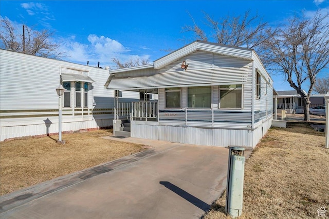 150 N 3050 E Unit 72, St George, UT 84790 - manufactured / mobile home with a porch and a front lawn