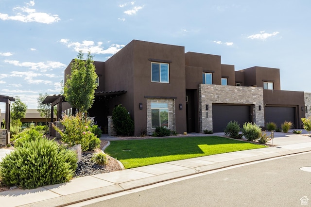 pueblo-style home with a front yard