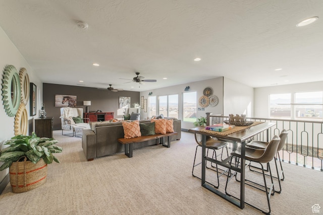 living room with light carpet and a textured ceiling