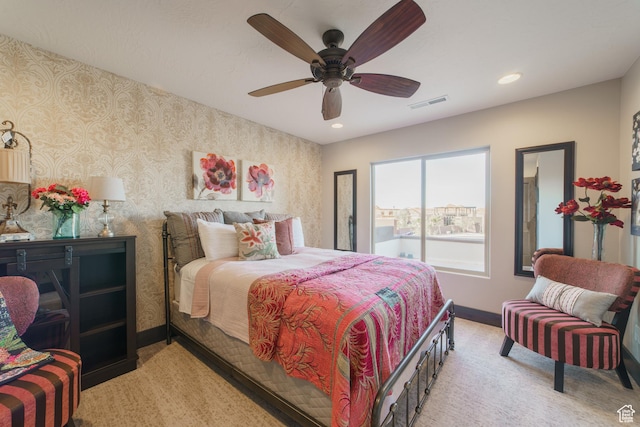 carpeted bedroom featuring ceiling fan