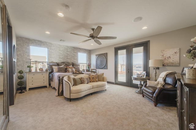 carpeted bedroom featuring access to exterior, french doors, and ceiling fan