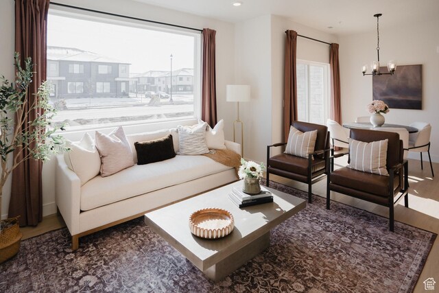 858 S 200 E Unit 3-204, Spanish Fork, UT 84660 - living room featuring a notable chandelier and wood-type flooring
