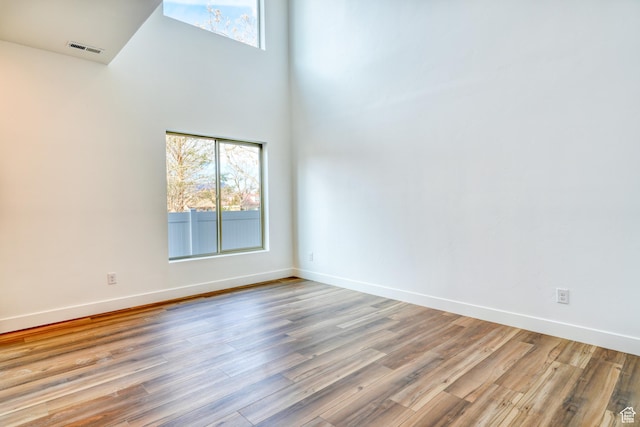 241 E 100 N Unit 3, Moab, UT 84532 - unfurnished room featuring a towering ceiling and light wood-type flooring
