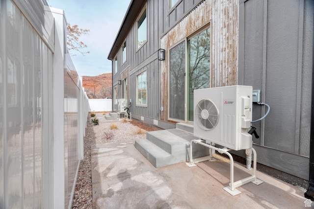 241 E 100 N Unit 3, Moab, UT 84532 - view of patio / terrace with a mountain view and ac unit