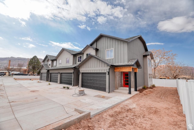 241 E 100 N Unit 3, Moab, UT 84532 - view of front of home featuring a garage and a mountain view