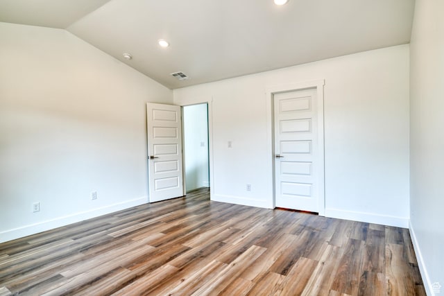 241 E 100 N Unit 3, Moab, UT 84532 - unfurnished bedroom with dark wood-type flooring, vaulted ceiling, and a closet