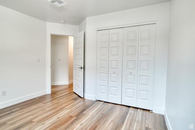 241 E 100 N Unit 3, Moab, UT 84532 - unfurnished bedroom with a closet and light hardwood / wood-style flooring
