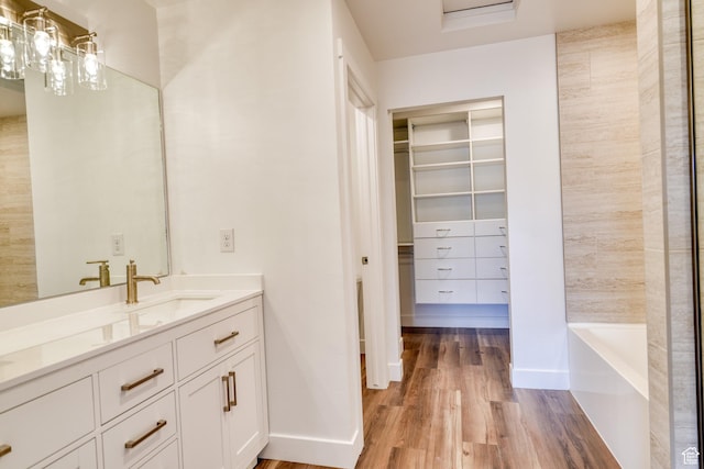 241 E 100 N Unit 3, Moab, UT 84532 - bathroom with vanity, hardwood / wood-style floors, and a bathing tub