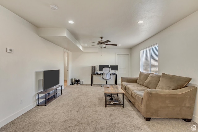 living room featuring light carpet and ceiling fan