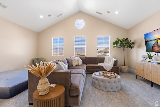 living room featuring carpet flooring, vaulted ceiling, and visible vents