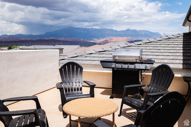 view of patio featuring a grill and a mountain view