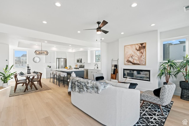 113 E Watson Dr S, Saratoga Springs, UT 84045 - living room with ceiling fan, sink, and light hardwood / wood-style floors