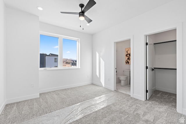 113 E Watson Dr S, Saratoga Springs, UT 84045 - unfurnished bedroom featuring connected bathroom, a spacious closet, light colored carpet, and a closet