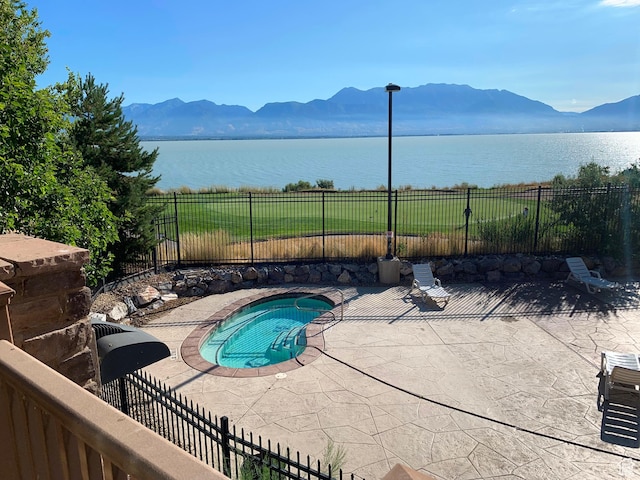 113 E Watson Dr S, Saratoga Springs, UT 84045 - view of swimming pool featuring a water and mountain view and a patio area