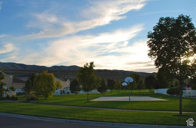 113 E Watson Dr S, Saratoga Springs, UT 84045 - view of community with a mountain view, basketball hoop, and a lawn