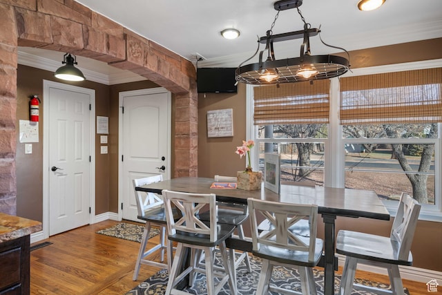 75 N 200 W, Kanab, UT 84741 - dining space with crown molding and wood-type flooring
