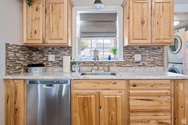 75 N 200 W, Kanab, UT 84741 - kitchen with stainless steel dishwasher, stacked washing maching and dryer, and light brown cabinetry