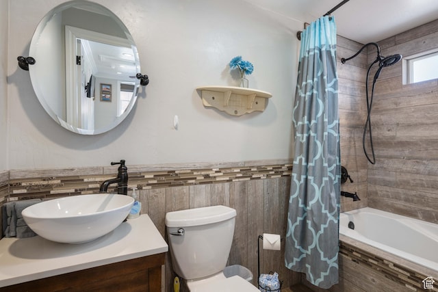 75 N 200 W, Kanab, UT 84741 - full bathroom featuring vanity, toilet, tile walls, and shower / bath combo