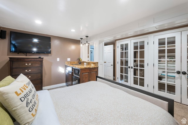 75 N 200 W, Kanab, UT 84741 - bedroom featuring sink and french doors