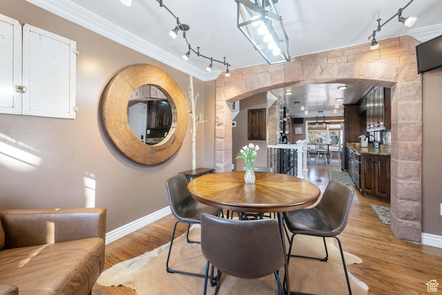 75 N 200 W, Kanab, UT 84741 - dining area featuring crown molding and light hardwood / wood-style floors