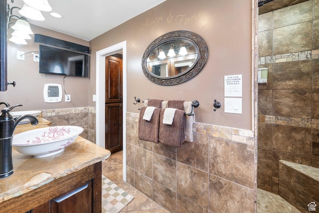 75 N 200 W, Kanab, UT 84741 - bathroom featuring tile walls, vanity, and tiled shower