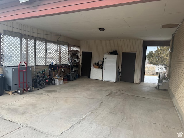 425 E 100 S, Mount Pleasant, UT 84647 - garage with a carport and white refrigerator