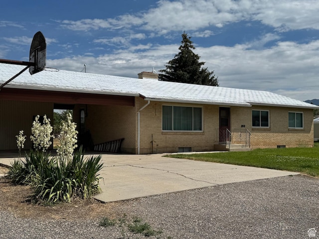 425 E 100 S, Mount Pleasant, UT 84647 - view of front facade with brick siding, driveway, and a chimney