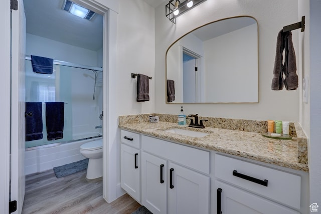 407 S Vasels Rd Unit 8, Brian Head, UT 84719 - full bathroom with toilet, wood-type flooring, bath / shower combo with glass door, and vanity