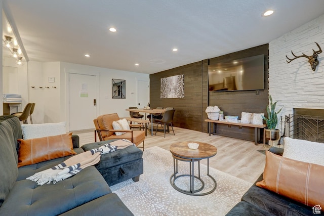 407 S Vasels Rd Unit 8, Brian Head, UT 84719 - living room featuring a stone fireplace and light wood-type flooring
