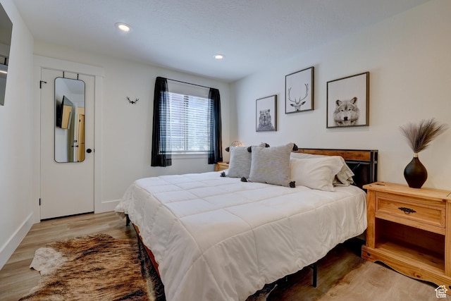 407 S Vasels Rd Unit 8, Brian Head, UT 84719 - bedroom featuring light hardwood / wood-style flooring