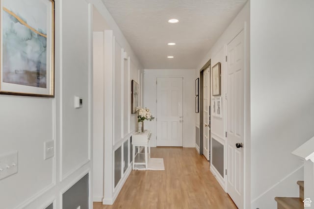 739 W Wild Hyacinth Dr, Saratoga Springs, UT 84045 - hall with a textured ceiling and light wood-type flooring