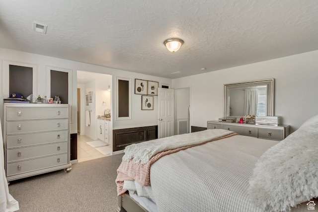 739 W Wild Hyacinth Dr, Saratoga Springs, UT 84045 - bedroom featuring ensuite bath, light carpet, and a textured ceiling