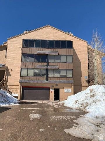 150 W Ridge View St Unit 241, Brian Head, UT 84719 - snow covered property featuring a garage