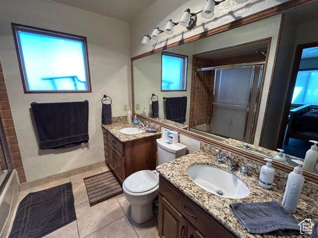 150 W Ridge View St Unit 241, Brian Head, UT 84719 - bathroom featuring vanity, toilet, tile patterned flooring, and a wealth of natural light
