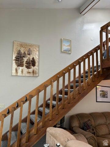 150 W Ridge View St Unit 241, Brian Head, UT 84719 - stairway with wood-type flooring and beam ceiling