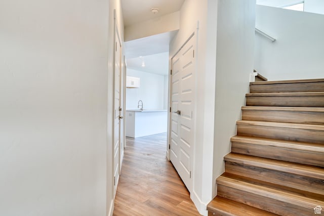 241 E 100 N Unit 4, Moab, UT 84532 - staircase featuring hardwood / wood-style flooring and sink