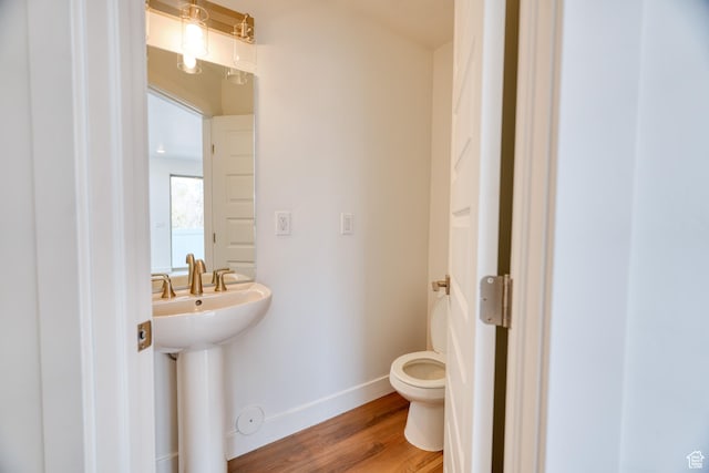 241 E 100 N Unit 4, Moab, UT 84532 - bathroom featuring sink, wood-type flooring, and toilet